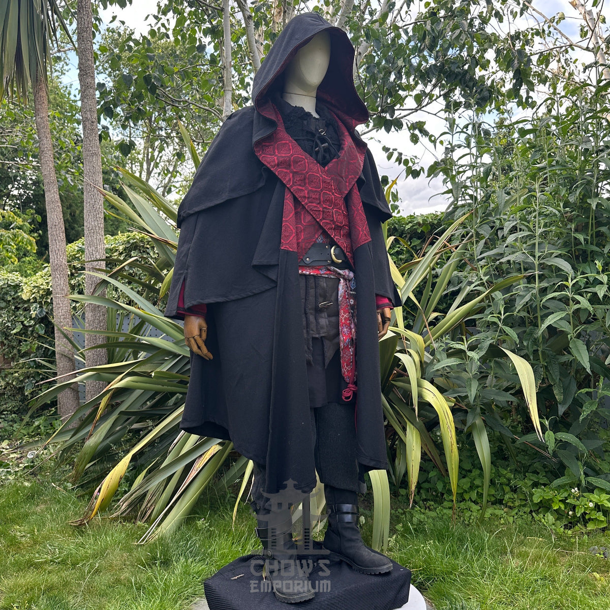 Mannequin wearing LARP necromancer cloak, hooded, in a.