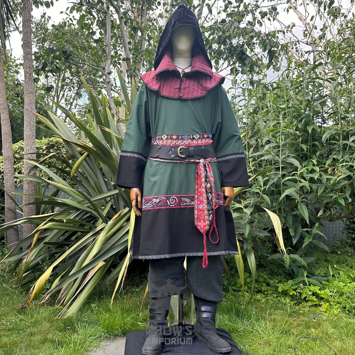 Medieval LARP outfit front view, featuring a green and black Viking tunic, gambeson hood.