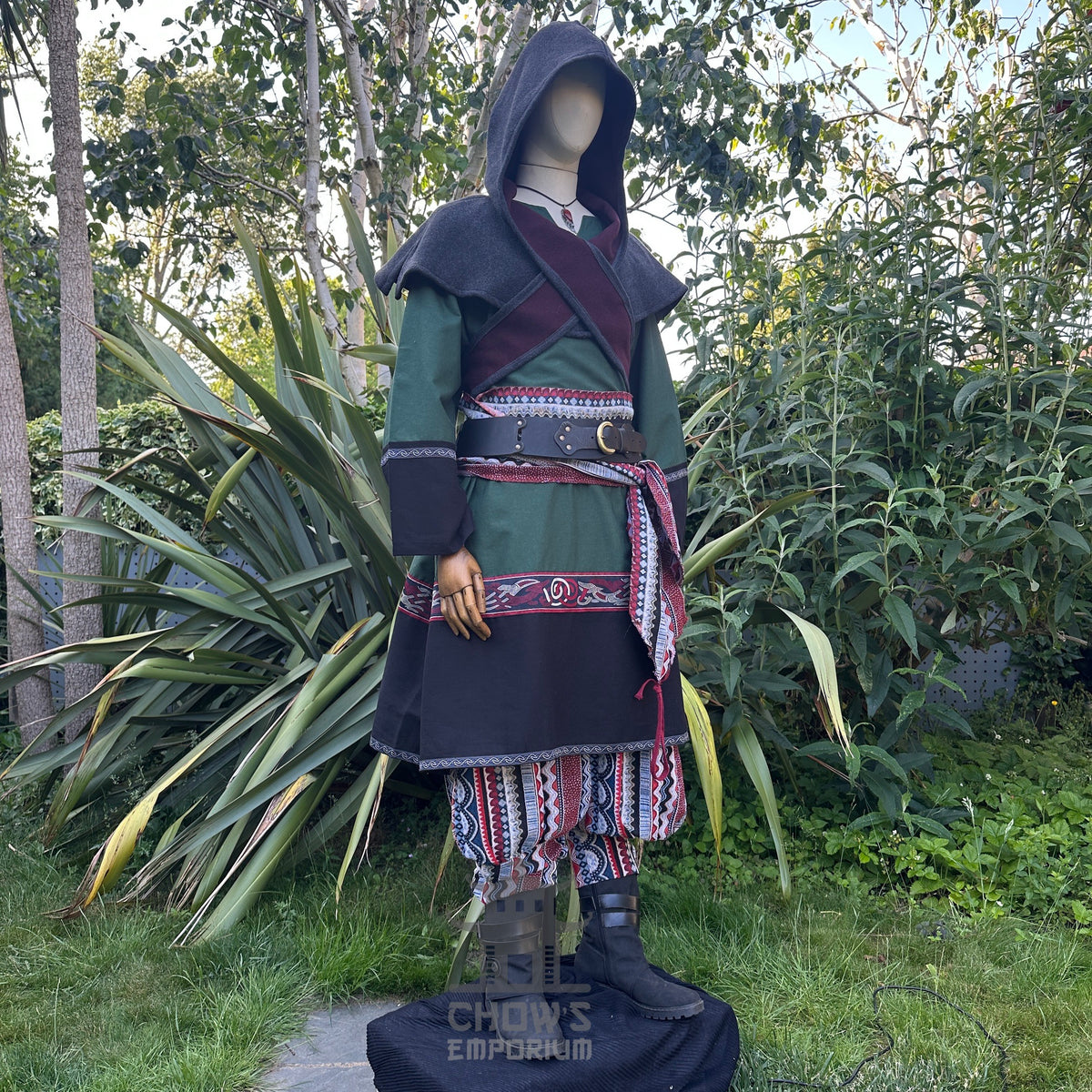 Emerald green LARP set with hooded robe, colorful tunic, and patterned trousers.
