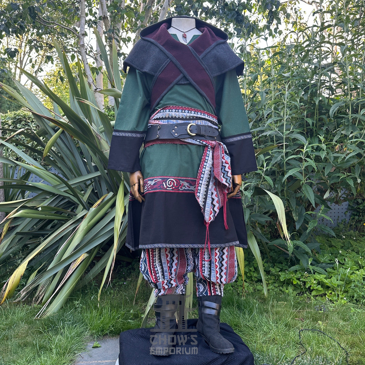 Green and black medieval LARP outfit with reversible hood and patterned sash.