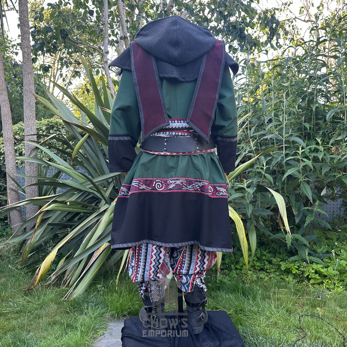 Back view: Green medieval LARP tunic and patterned trousers with hood.