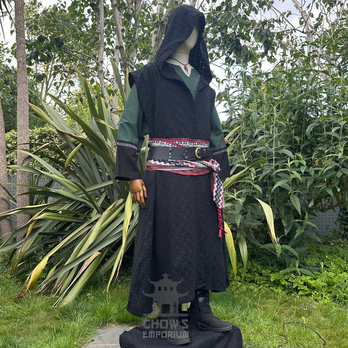 Medieval LARP costume side view featuring sleeveless robe, tunic, hood, pants, belt and sash.