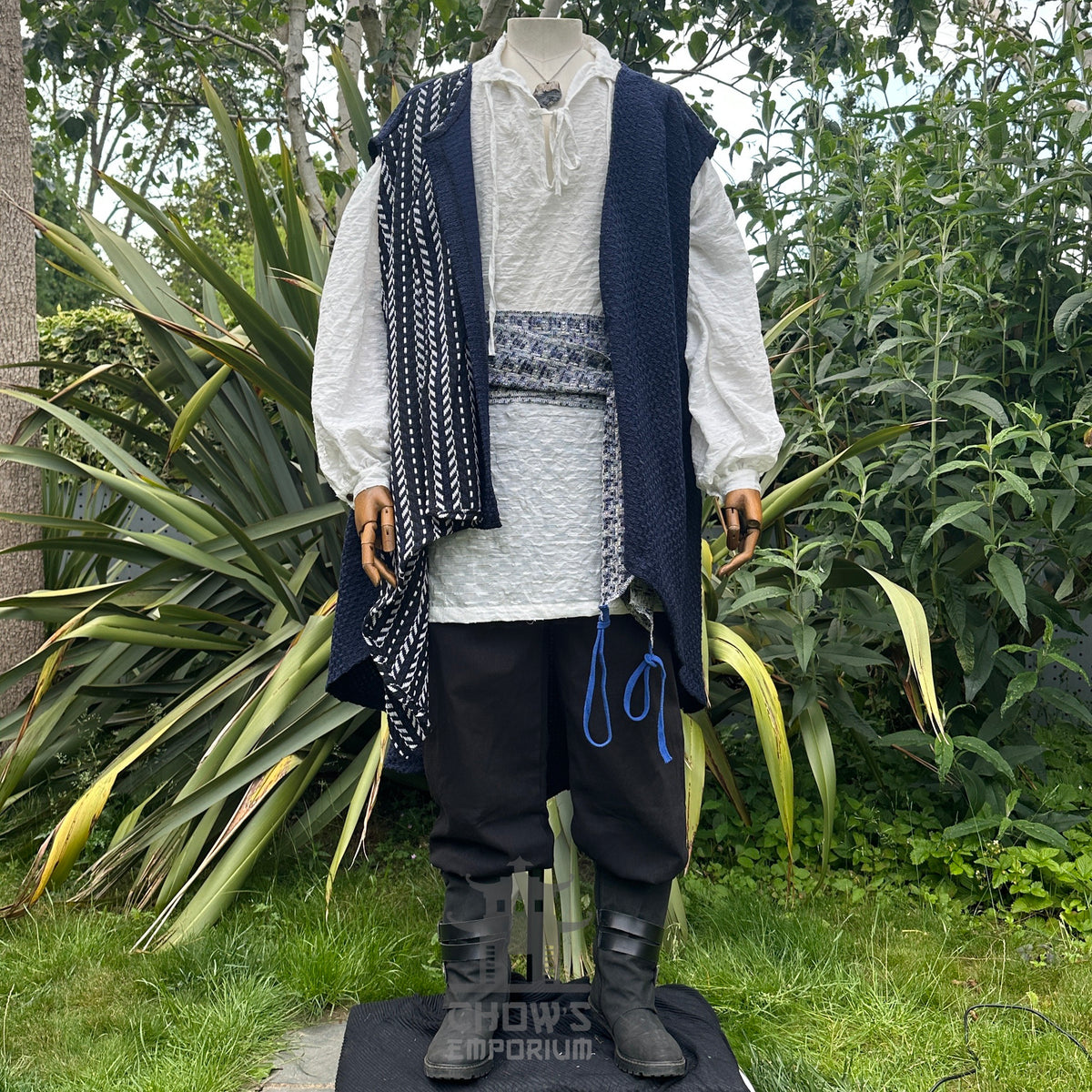 Front view of open pirate waistcoat showing shirt and sash styled for medieval cosplay.