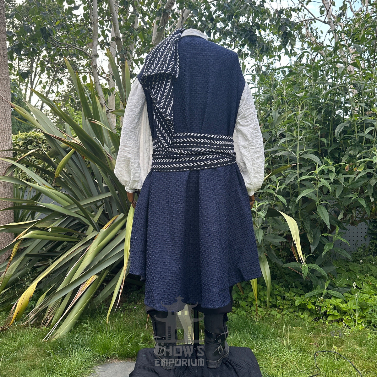 Back view of blue and white pirate costume with panel worn over shoulder for dramatic fantasy look.