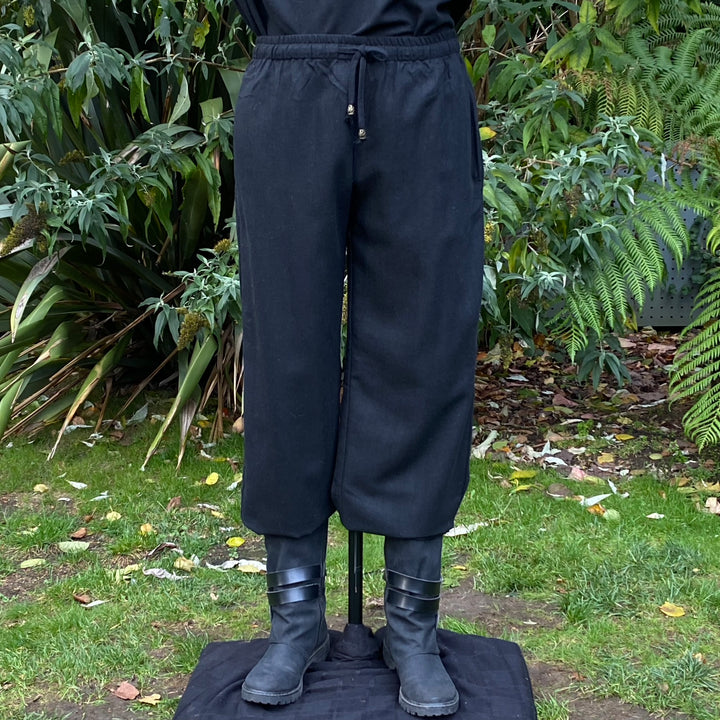 Black LARP trousers with drawstring waist, paired with black boots.