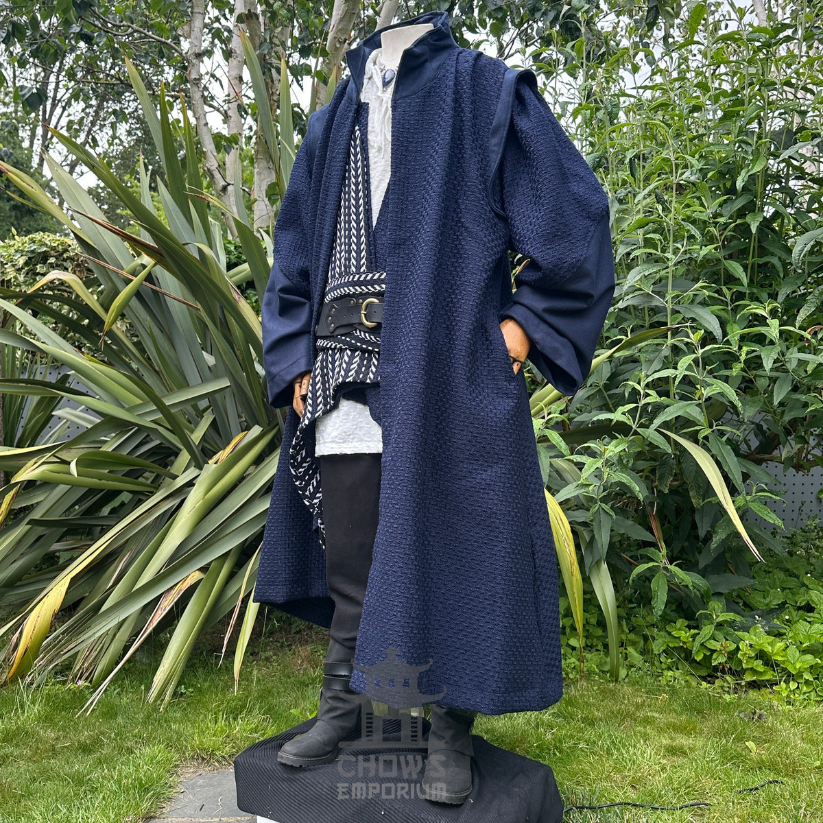 Medieval LARP costume side view featuring a robe, waistcoat, shirt, pants, sash and necklace.