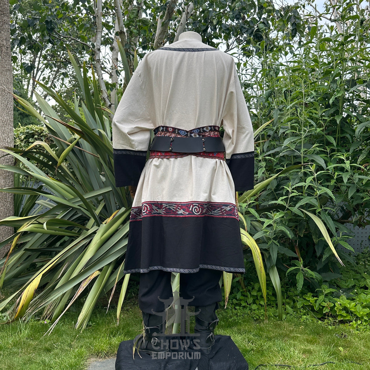 White and black Viking tunic for LARP, back view, with intricate trim.