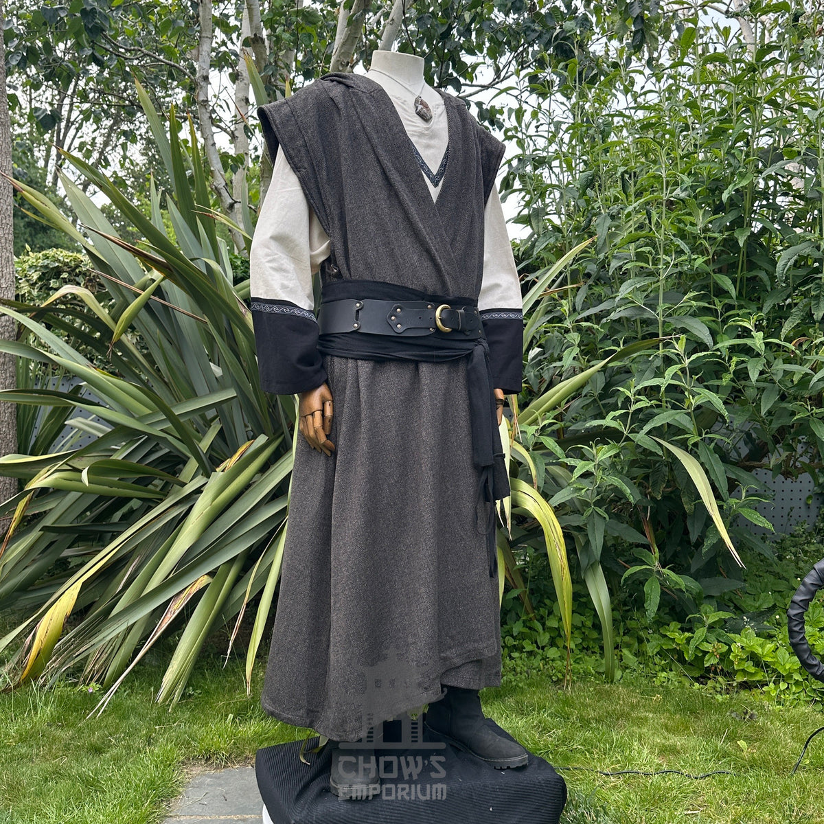 Angled front view of herringbone brown sleeveless LARP robe, authentic medieval fantasy cosplay.