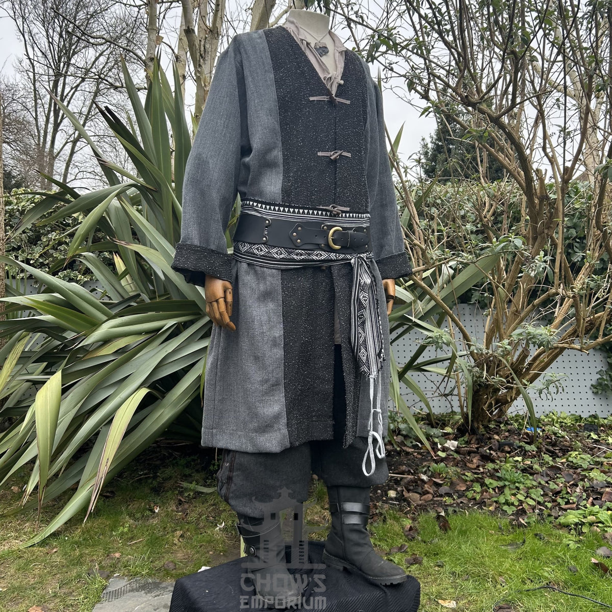 Angled front view of two-tone grey and black LARP coat, fantasy cosplay costume with.