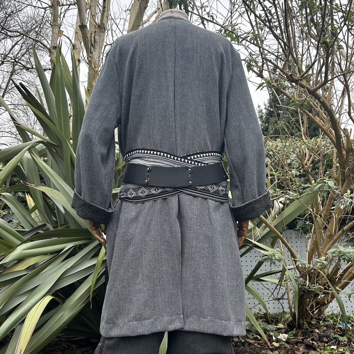 Back angle of grey-black LARP pirate coat with decorative belt.