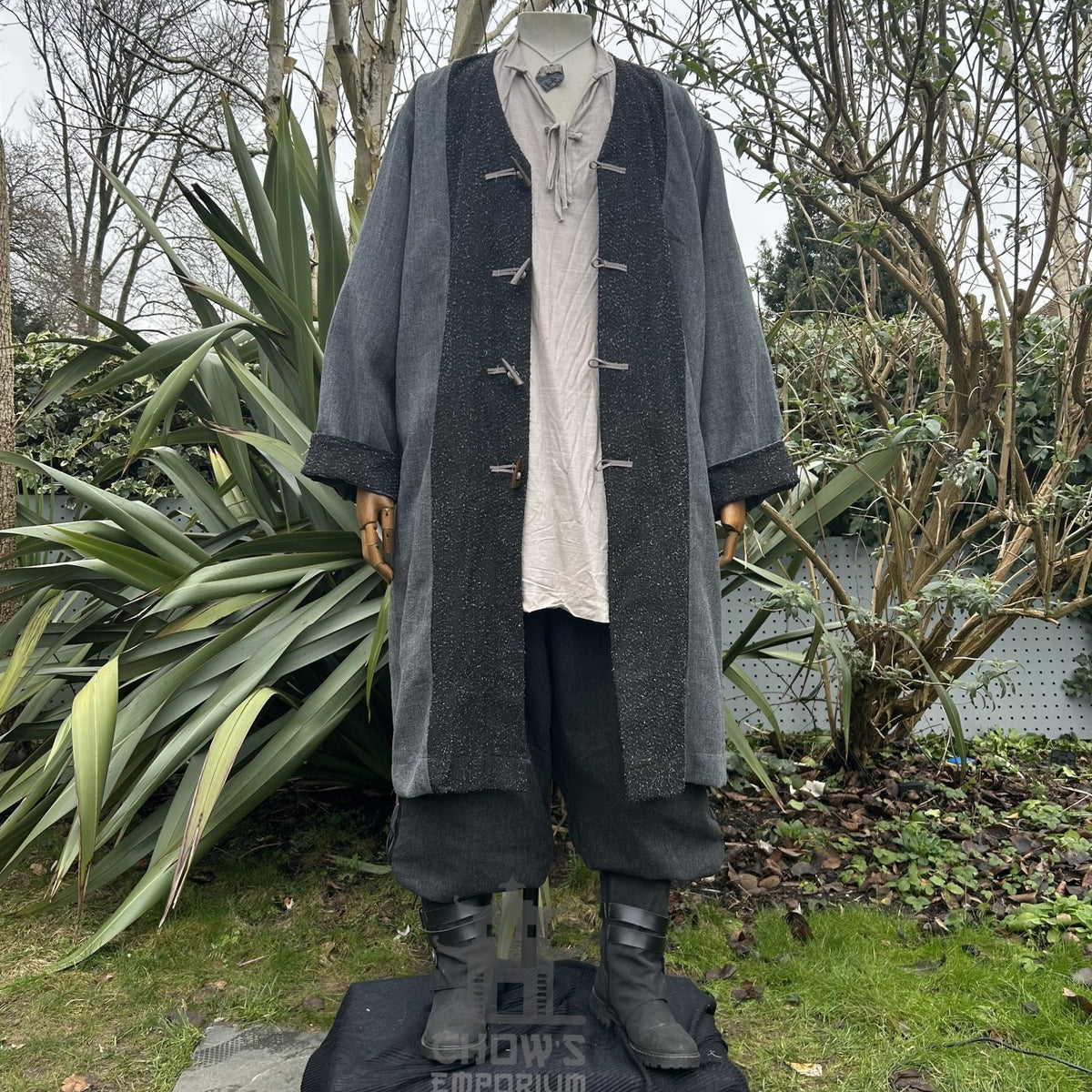 Medieval LARP pirate coat outdoors, front view with foliage background.