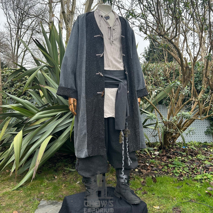 Medieval LARP outfit side view, featuring a grey two-tone jacket, shirt, trousers, belt and sash. For Renaissance Faire and historical roleplay events.