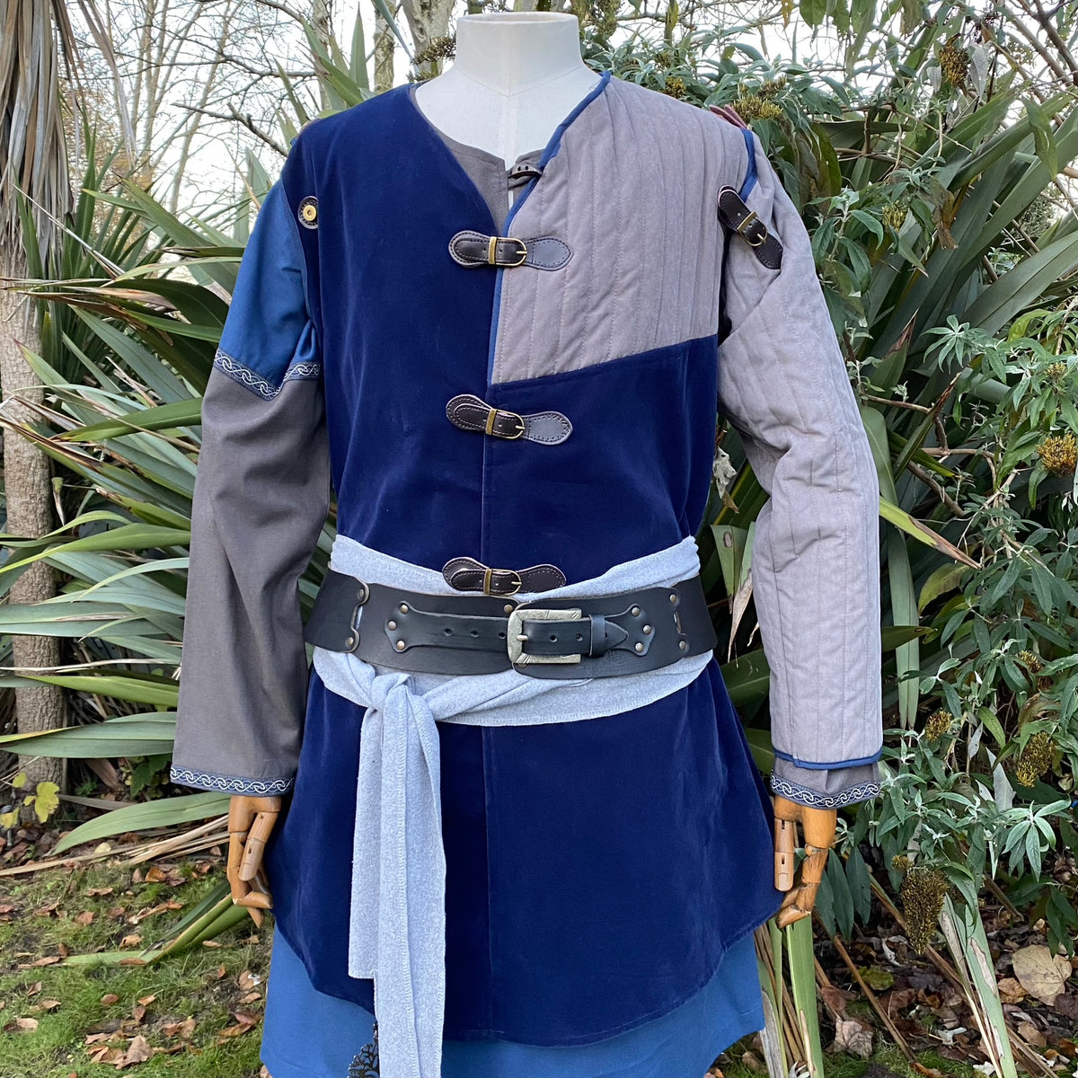 Azure and grey medieval LARP gambeson jacket, front view with buckles.