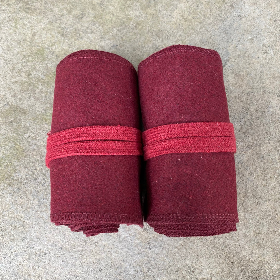 Set of Medieval LARPing Leg Wraps. They are Red and made out of a Wool mixture which are used to keep Trouser flares out of the way and legs warm. These Viking Wraps can wrap around your Legs to provide an extra flare to LARP kit.