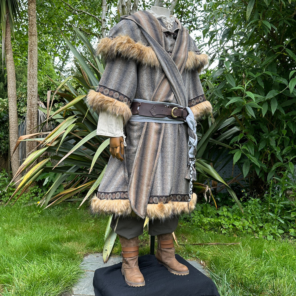 Medieval LARP outfit side view, featuring a brown and grey fur trim tunic and matching hood.