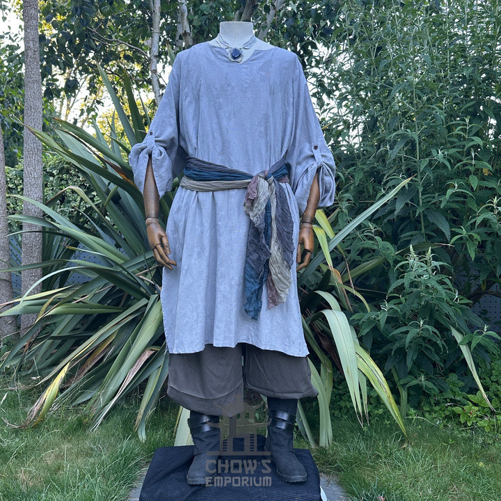 Medieval LARP outfit front view, featuring a grey cotton tunic, trousers and sash. For Renaissance Faire and historical roleplay events.