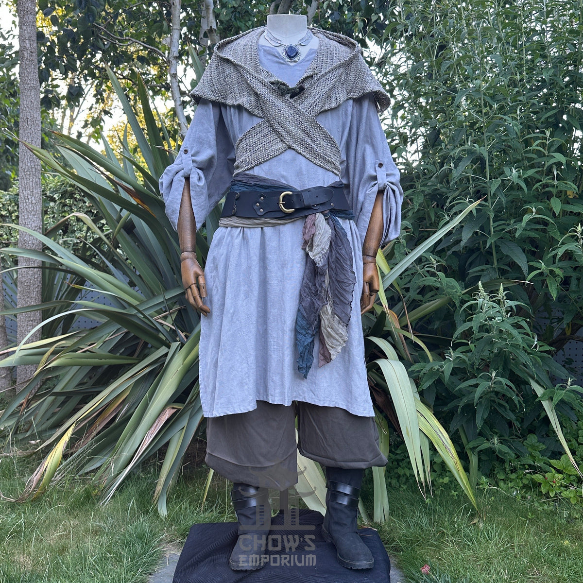 Medieval LARP outfit front view, featuring a grey cotton tunic, wrap around hood, trousers and sash.