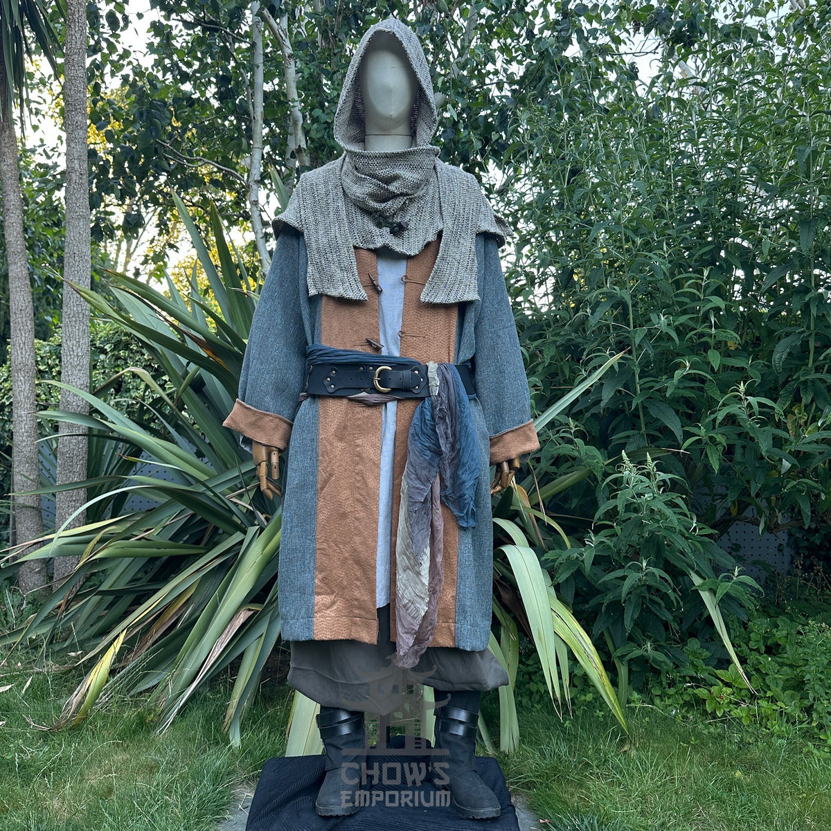 Medieval LARP outfit with textured hood, layered robe, and belted sash.