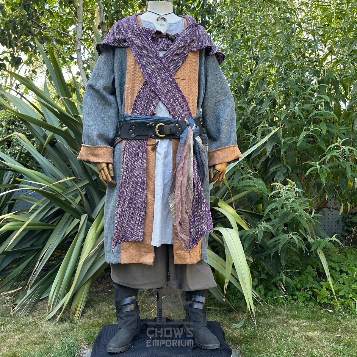Medieval LARP cleric outfit with layered robe and ornate belt.