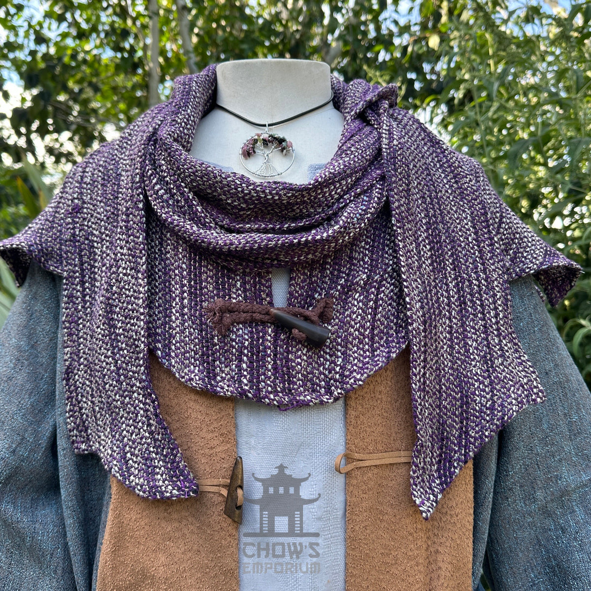 Purple knit hood with ivory accents on a mannequin, ideal for medieval LARP.