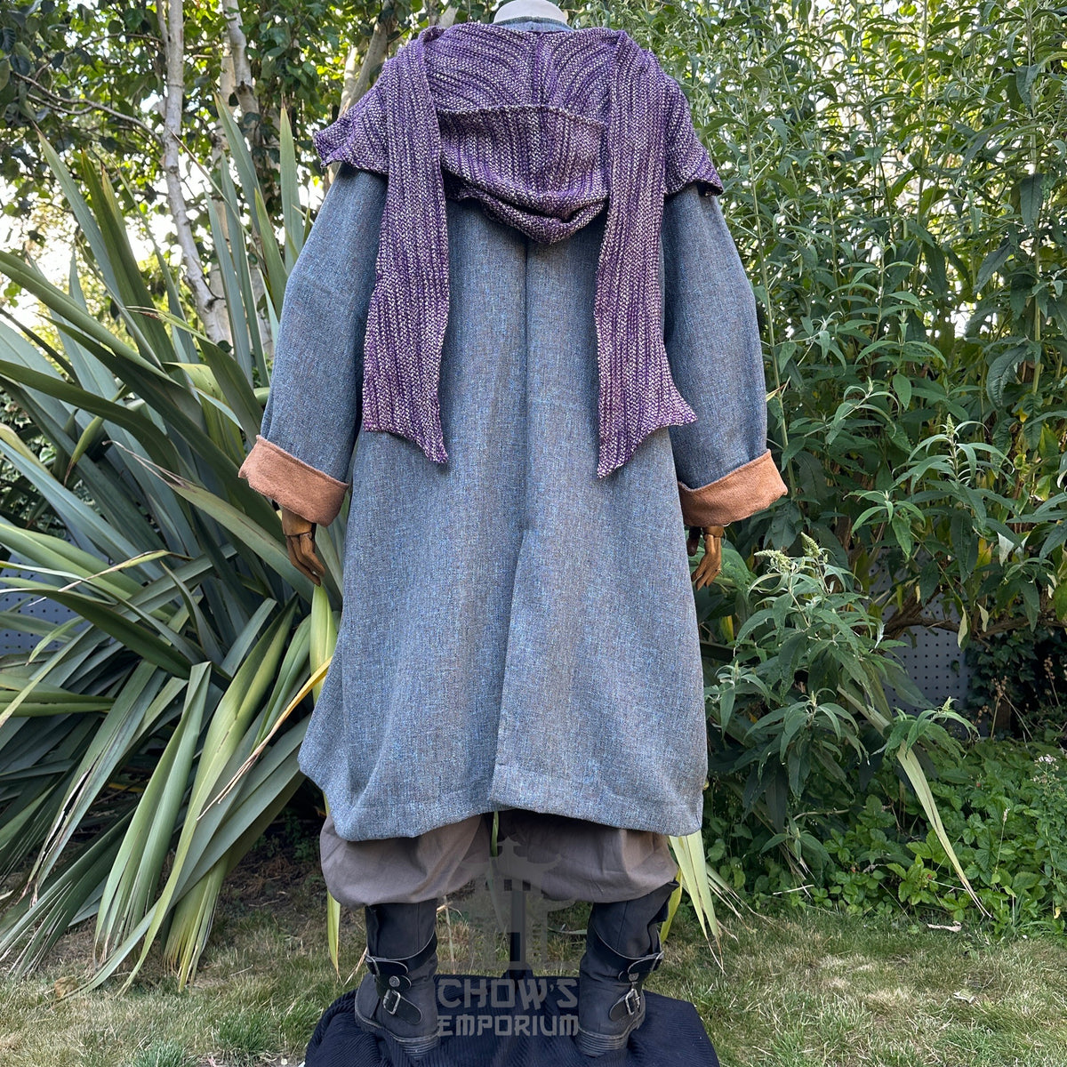 Rear view of medieval LARP robe with purple shoulder drape.
