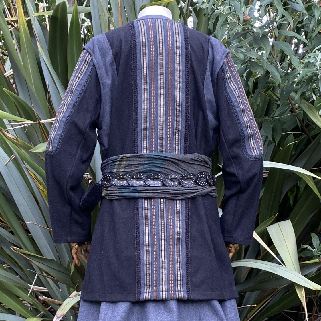 Back view of medieval LARP jacket with striped panels and belt detailing.