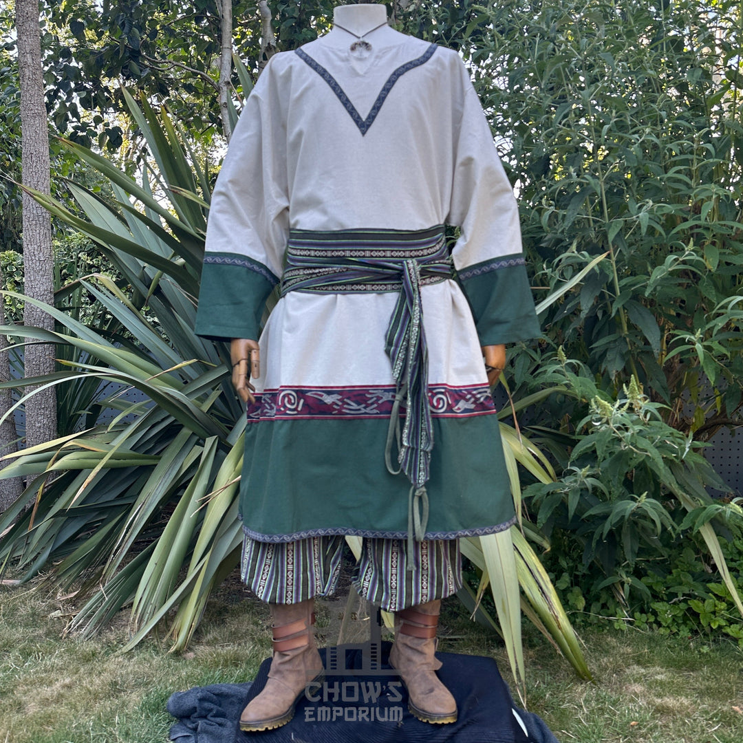 Medieval LARP outfit front view, featuring a white and green tunic, striped trousers and matching sash. For Renaissance Faire and historical roleplay events.