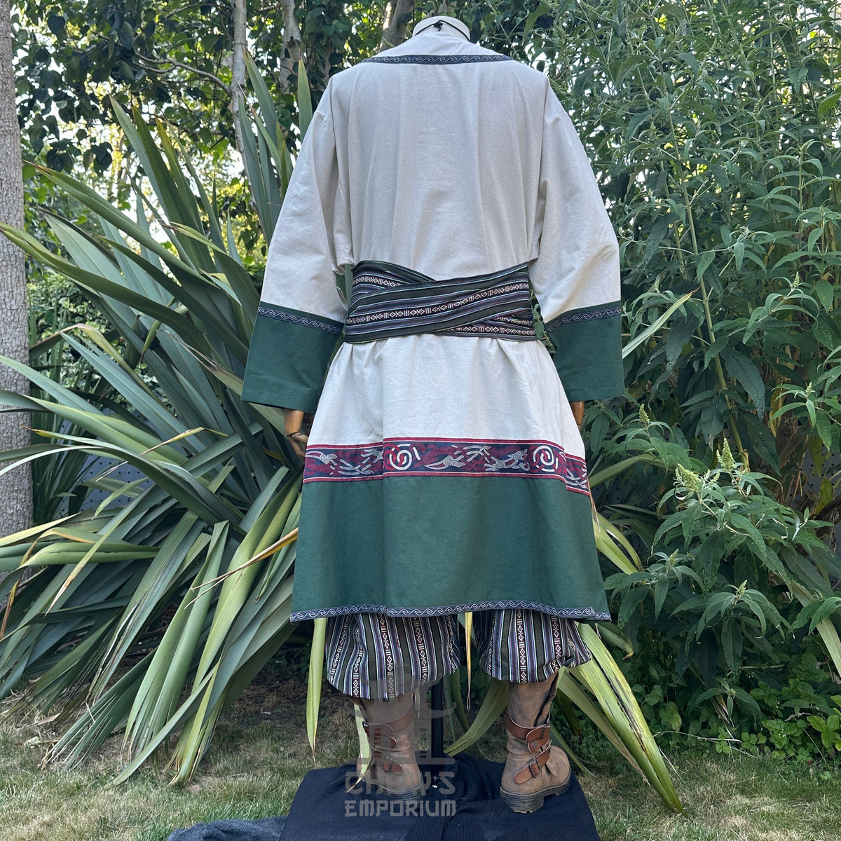Rear view of Woodland Merchant LARP set with green accents, patterned sash.
