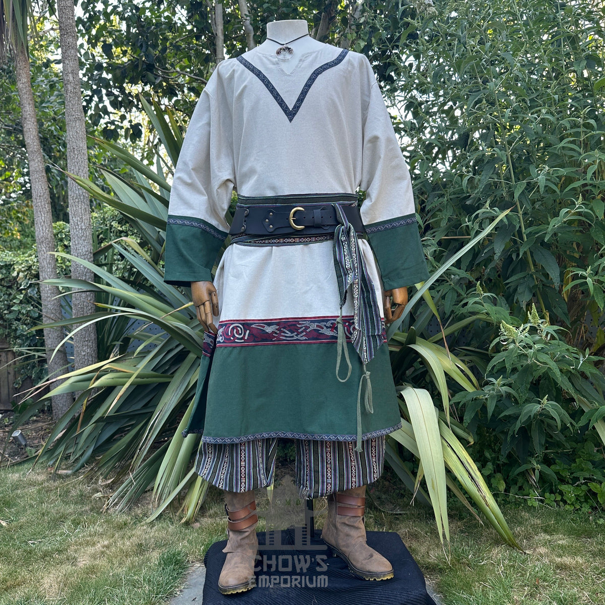 Medieval LARP outfit with green trim tunic, belt, and brown boots front view.