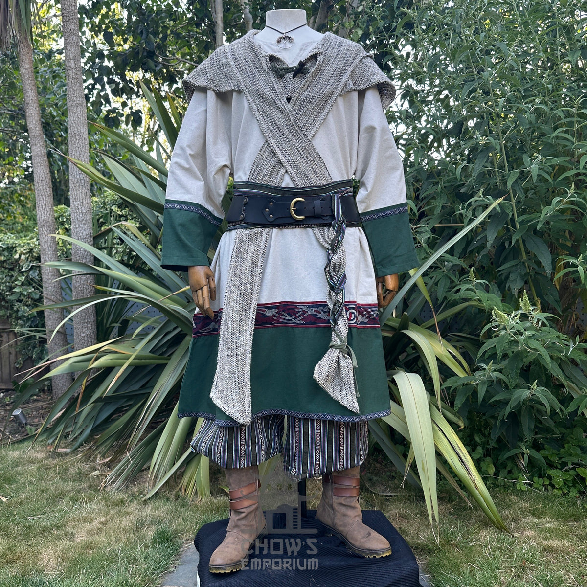 Woodland Merchant LARP attire with green and beige tunic, scarf, and necklace.