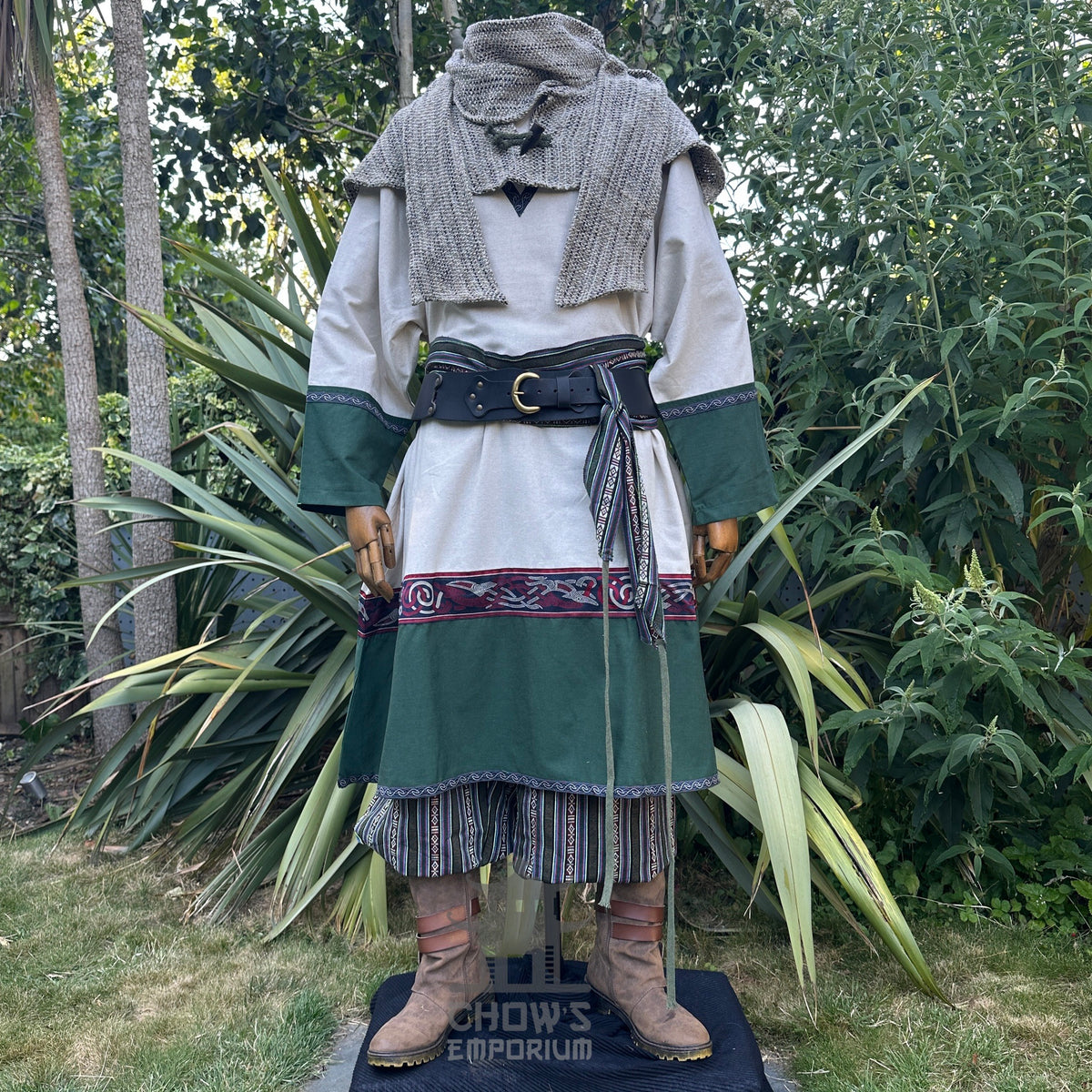 Rustic LARP outfit with cream tunic, green accents, brown boots, and belt.
