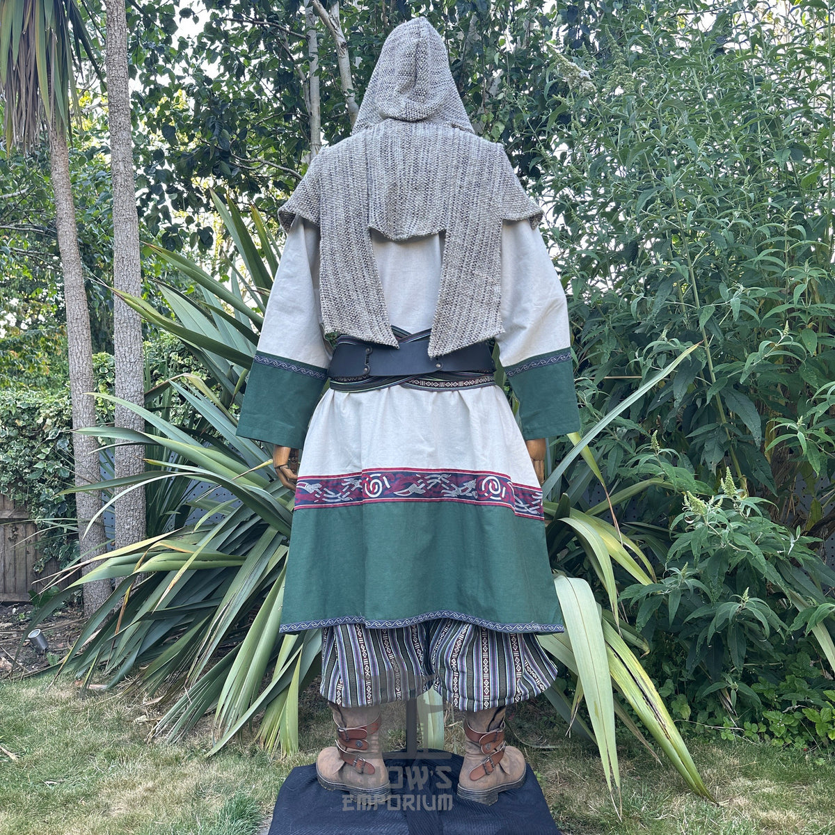 Back view of Woodland Merchant LARP outfit with green coat and knit hood.