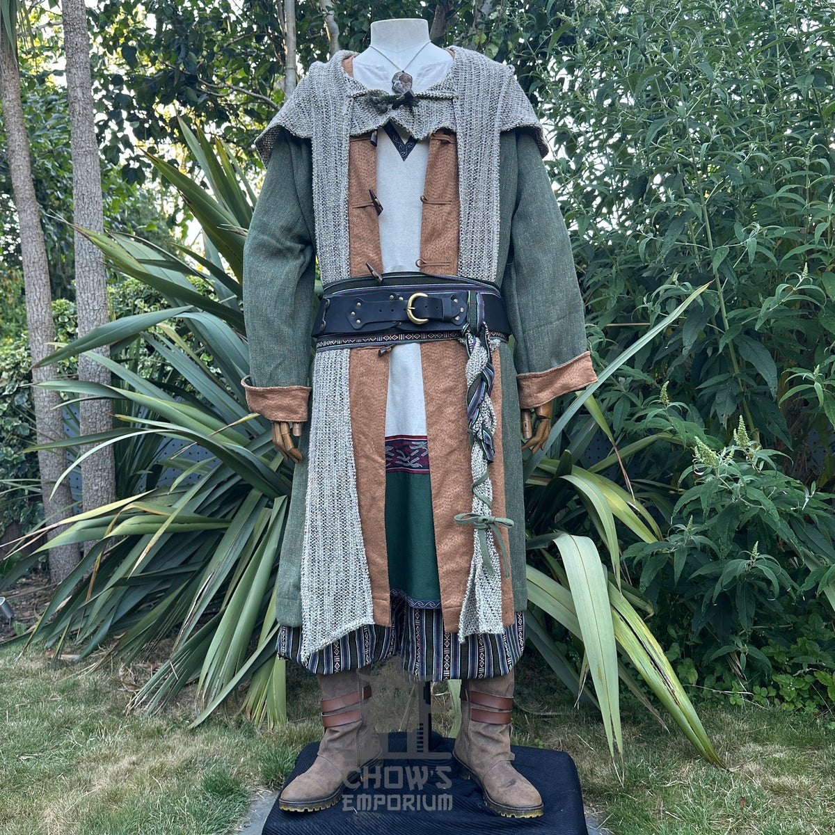 Medieval LARP costume front view featuring a green pirate coat, tunic, hood, sash and necklace.