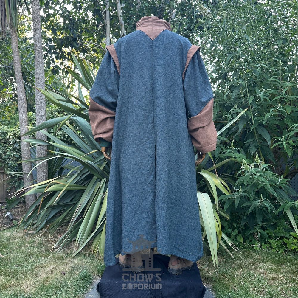 Medieval LARP costume back view featuring teal robe, tunic, pants, belt, sash and necklace. For Renaissance Faire and historical roleplay events.