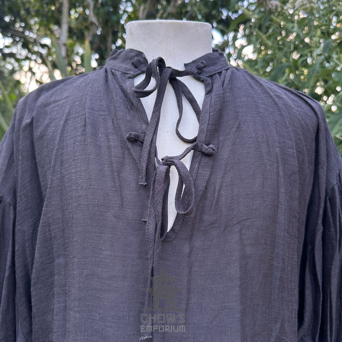 Medieval necromancer LARP shirt, black-grey tie neckline, close-up view.