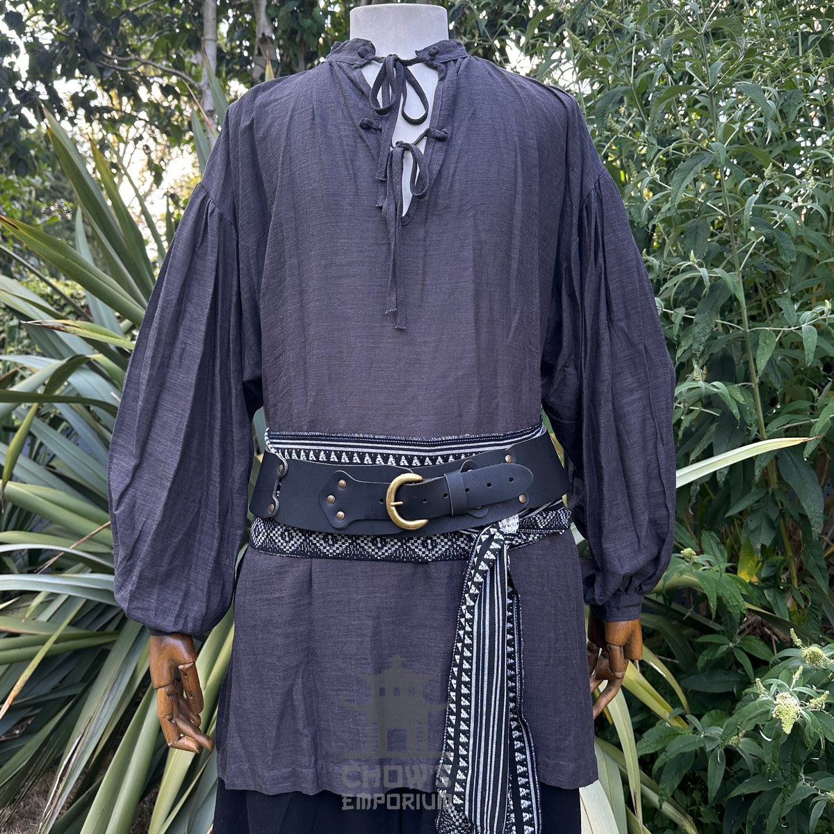 Dark grey medieval LARP shirt with wide sleeves, black belt, and patterned sash.