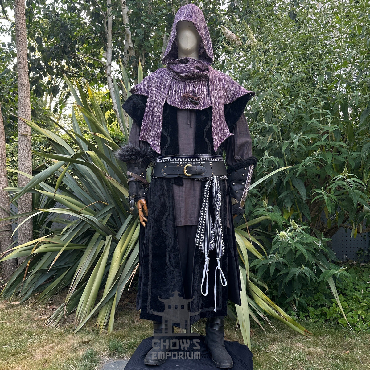 Black and purple LARP outfit with waistcoat, hood, and sash.