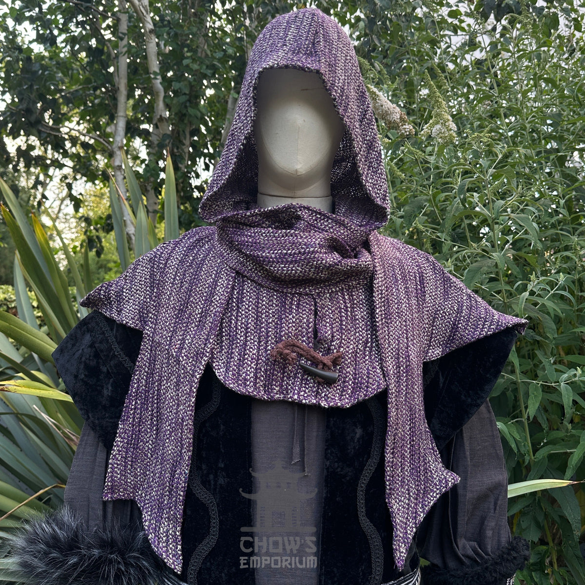 LARP outfit with black waistcoat, purple hood, and sash.
