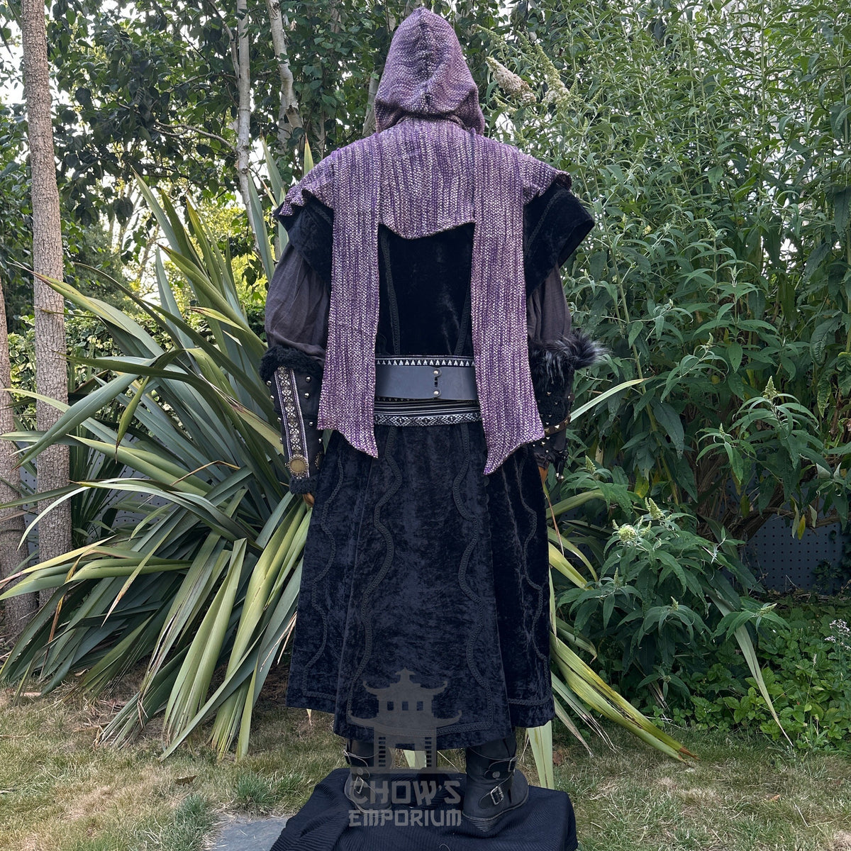 Black and purple medieval LARP outfit with hood, waistcoat, and sash, rear view.