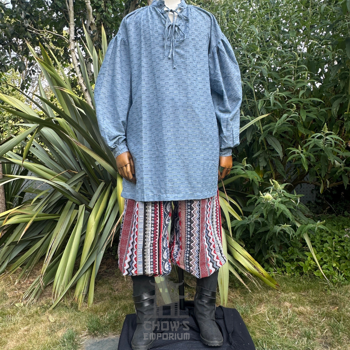 Medieval LARP shirt in textured blue cotton, front view, on display.