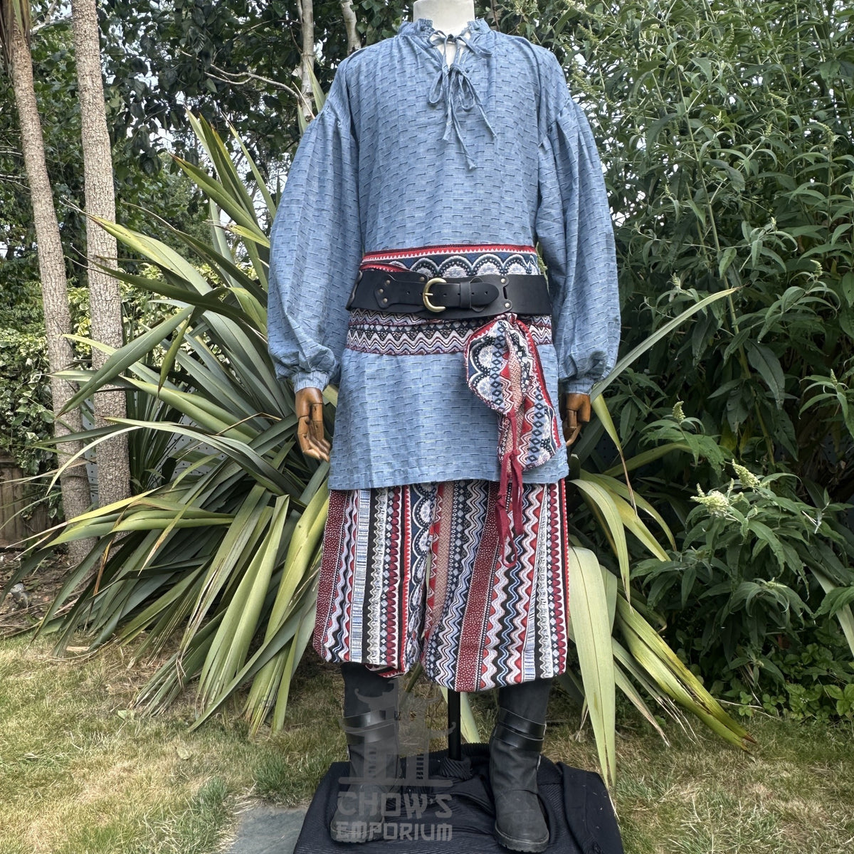 LARP blue medieval shirt, red Nordic zigzag pants, and sash on mannequin.