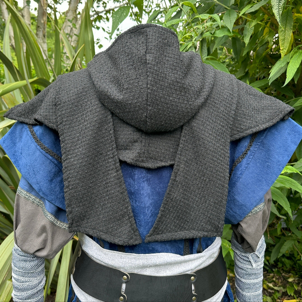 Black hooded cloak and blue tunic for medieval LARP, rear view.
