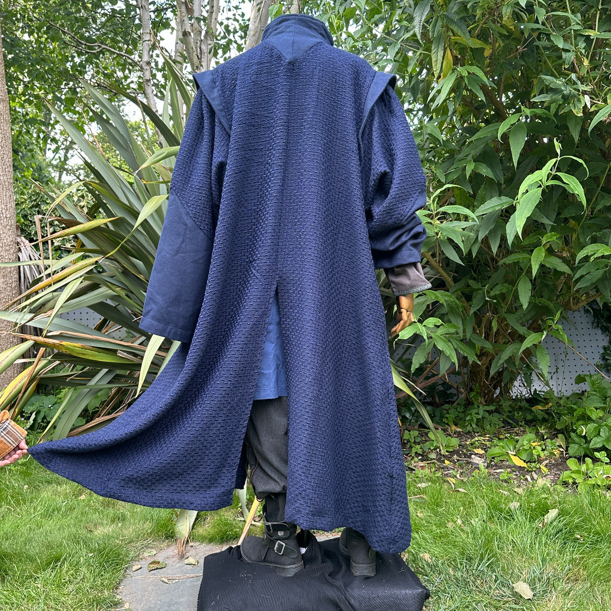 Back view of LARP navy robe with flowing textured fabric.