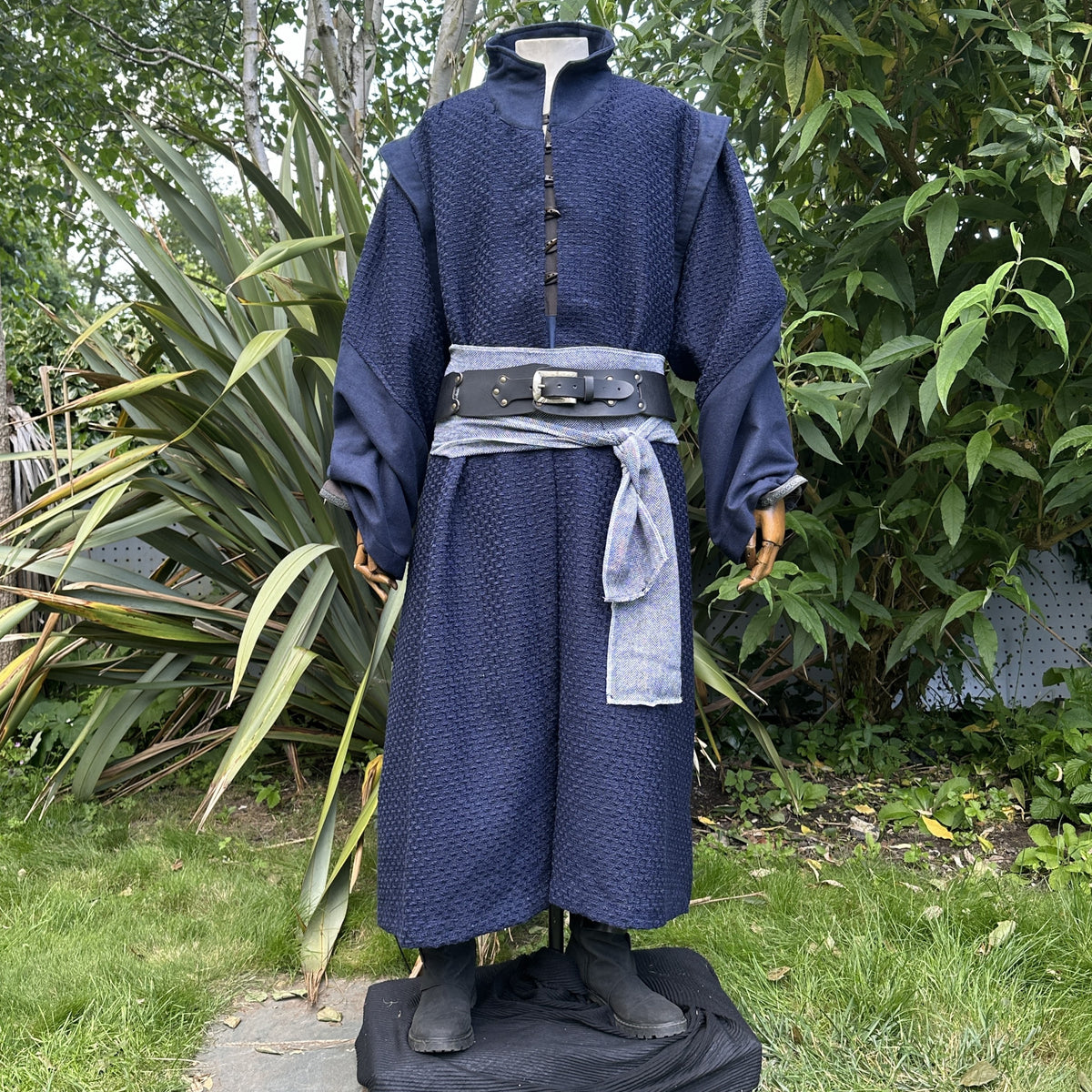 Mannequin in navy medieval LARP robe with detailed belt.