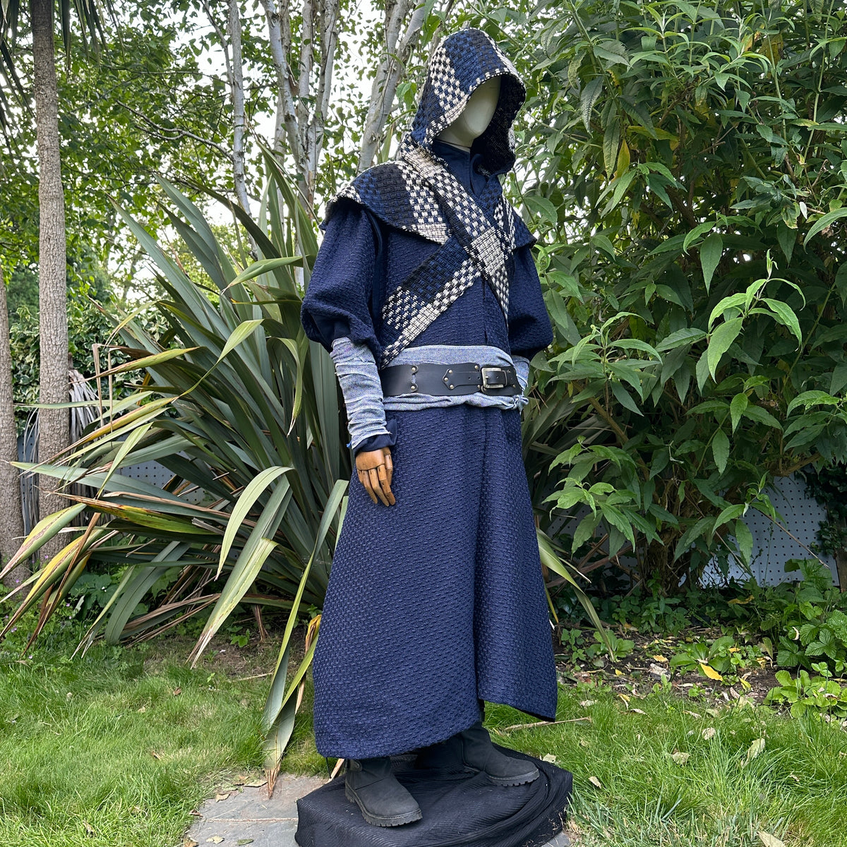 Medieval LARP outfit with blue robe, hood up, and black belt.