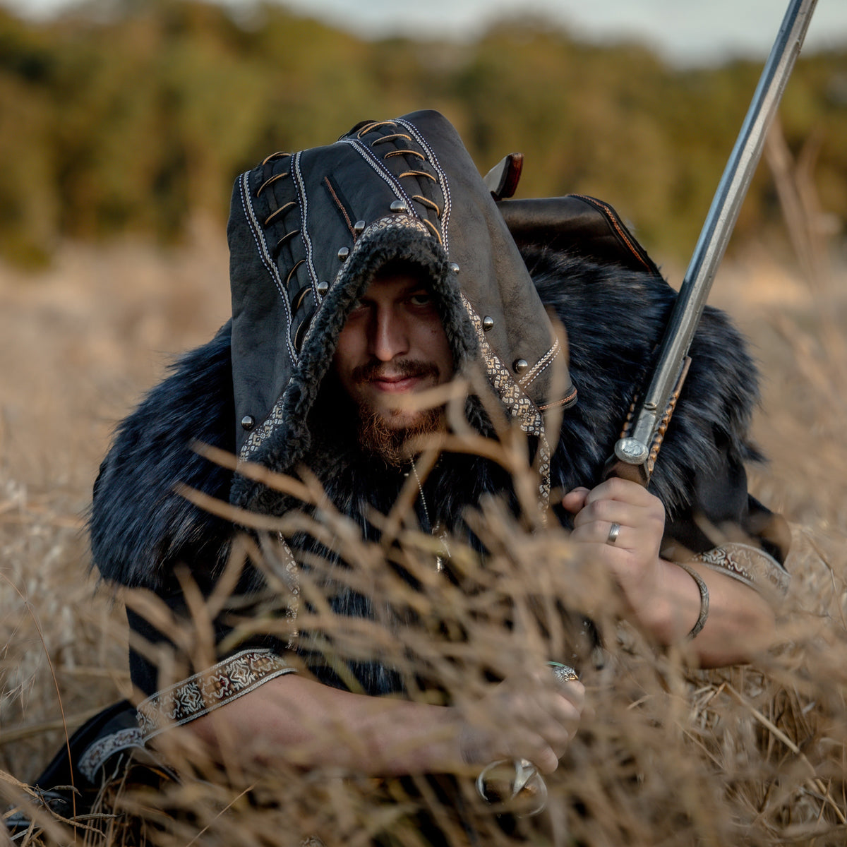 Black ornate faux leather hood with faux fur trim, medieval LARP style.