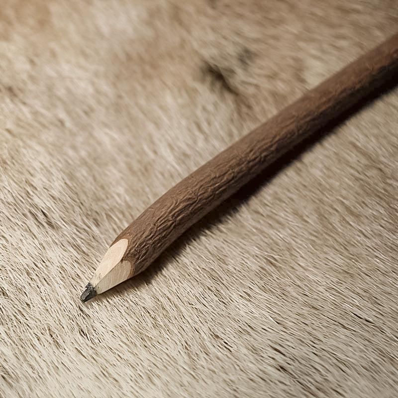 Twig Pencil close-up on fur, angled view for medieval LARP use.