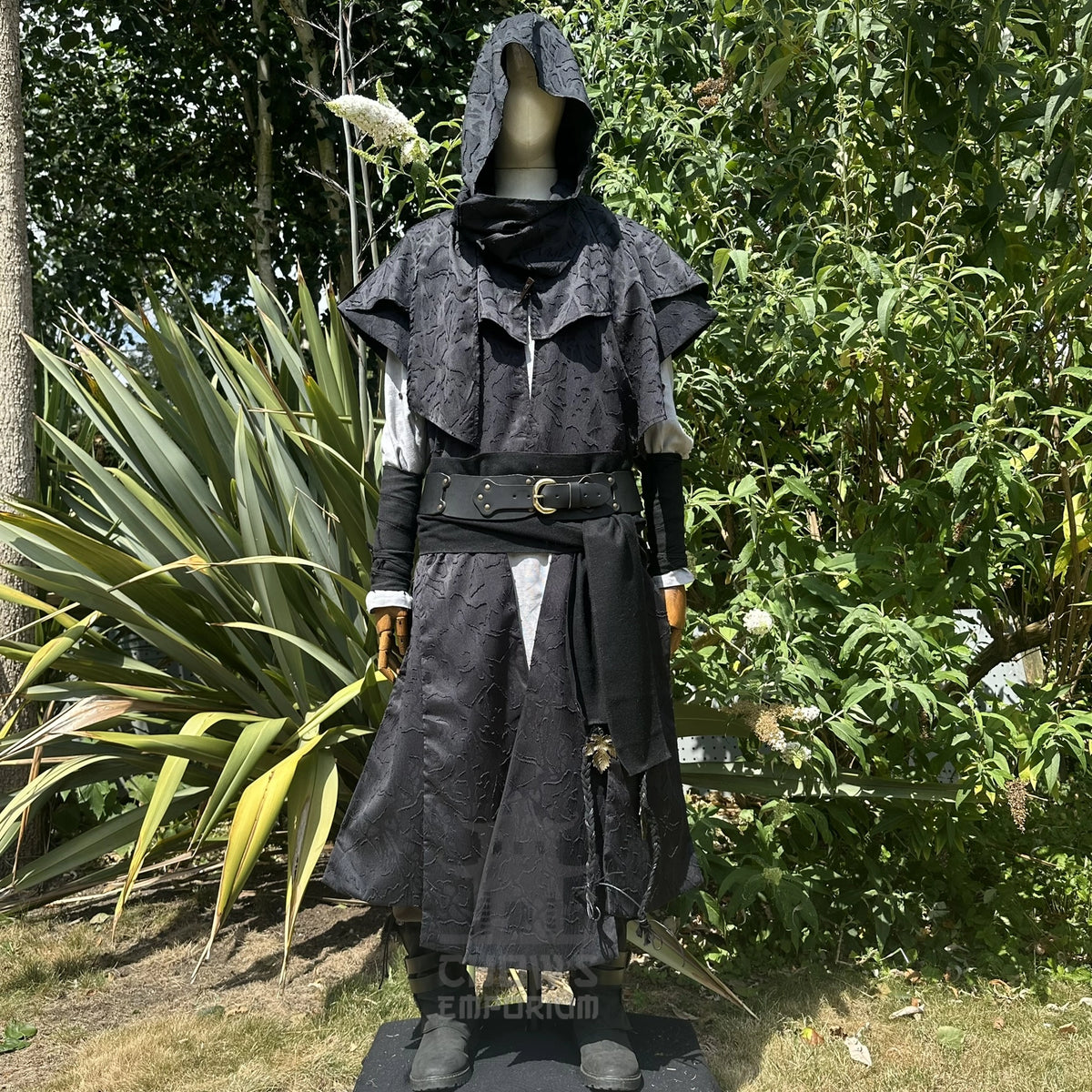 Black waistcoat and hood set with the hood up and draped as a cape over the shoulders, front view. Shirt and belt sold separately.