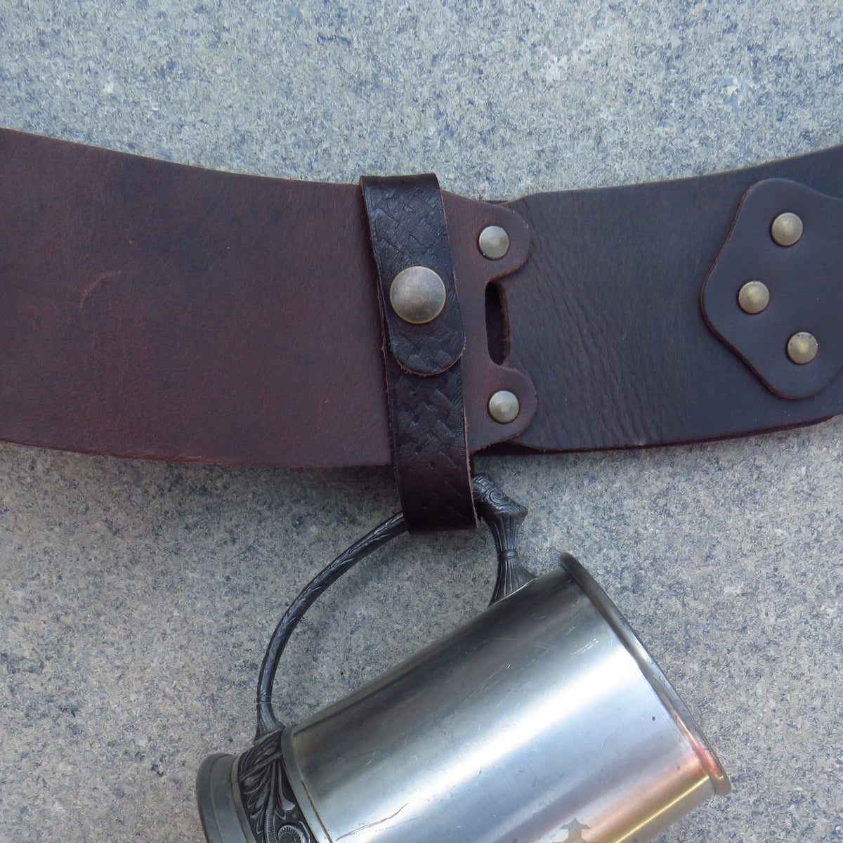 Dark brown Celtic knot tankard loop on a belt, side view