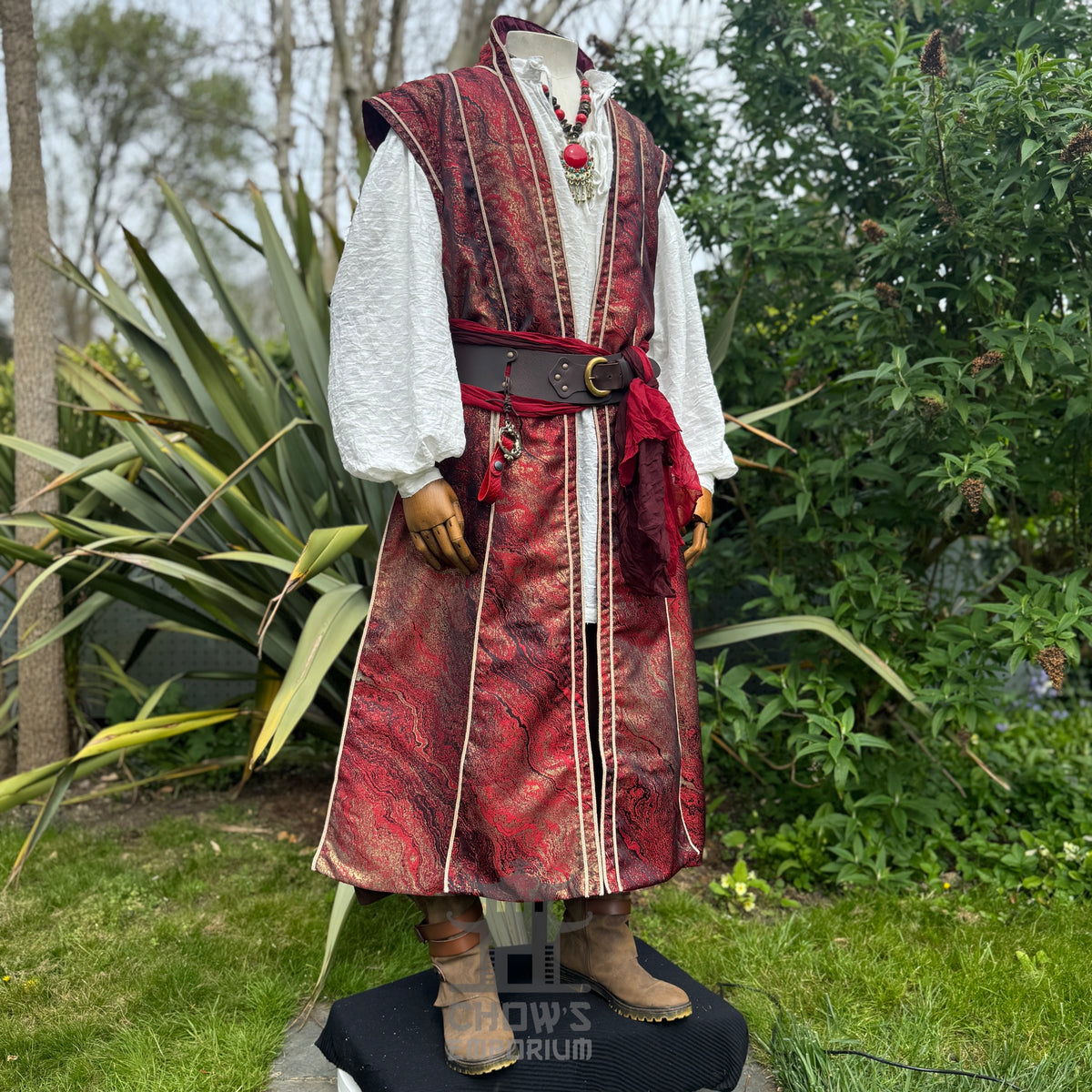 Side view of the red and gold marbled waistcoat over a white cotton shirt